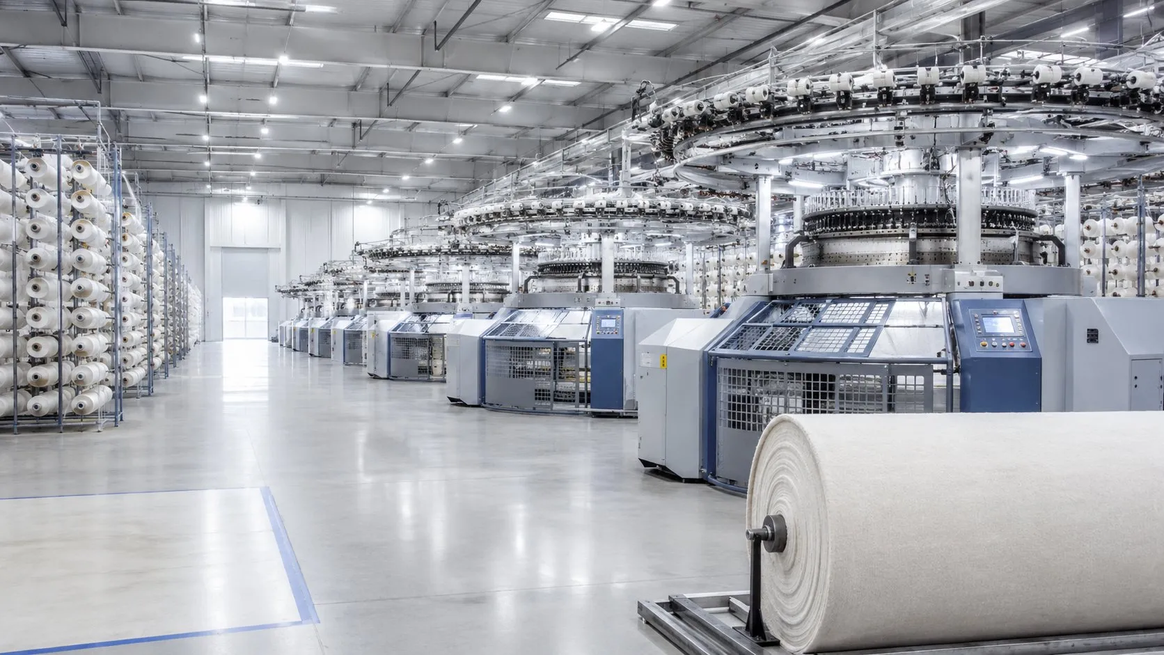 KARCEM production facility — circular knitting machines and yarn storage